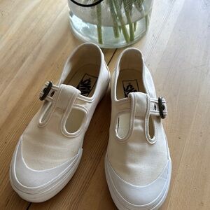 Vans Cream Slip-On Sneakers